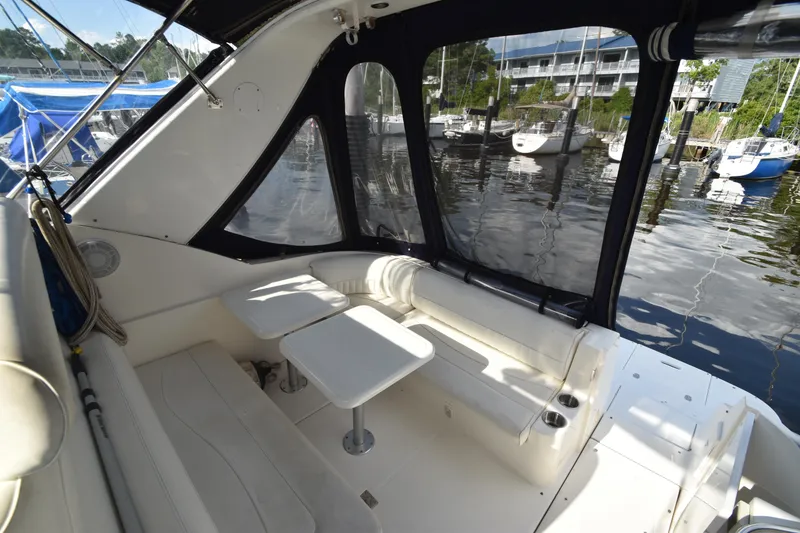 Slide: The Image of Interior of a 2004 Cruisers Yachts 320 Express with seating area. - 14