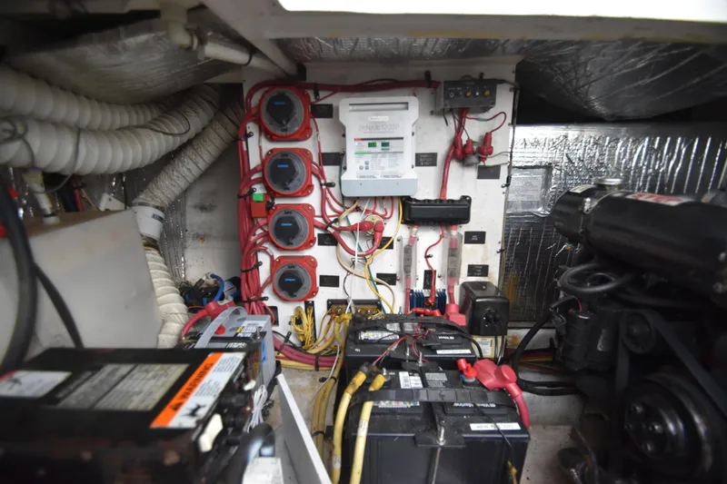 Slide: The Image of 2004 Cruisers Yachts 320 Express engine room with batteries. - 17