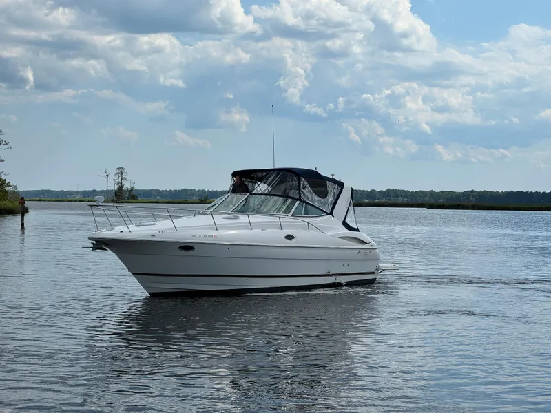 Slide: The Image of 2004 Cruisers Yachts 320 Express on calm water. - 19