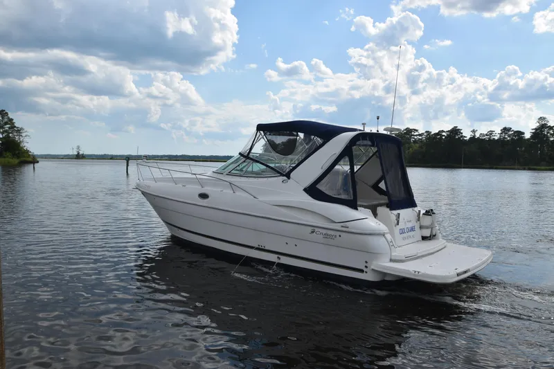 Slide: The Image of 2004 Cruisers Yachts 320 Express on calm water. - 2