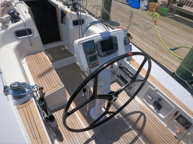 Slide: The Image of Cockpit of 2010 Finn Flyer 33 R sailboat with steering wheel and navigation instruments. - 15