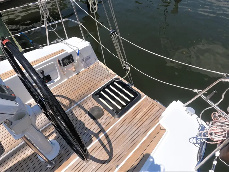 Slide: The Image of Cockpit of 2010 Finn Flyer 33 R sailboat with steering wheel and teak decking. - 17