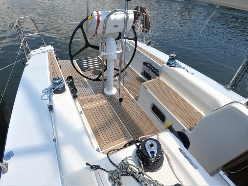 Slide: The Image of Cockpit of 2010 Finn Flyer 33 R sailboat with steering wheel and teak decking. - 20