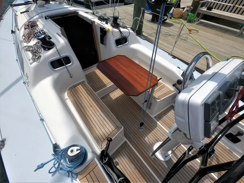 Slide: The Image of Cockpit of 2010 Finn Flyer 33 R sailboat with teak decking and navigation equipment. - 21