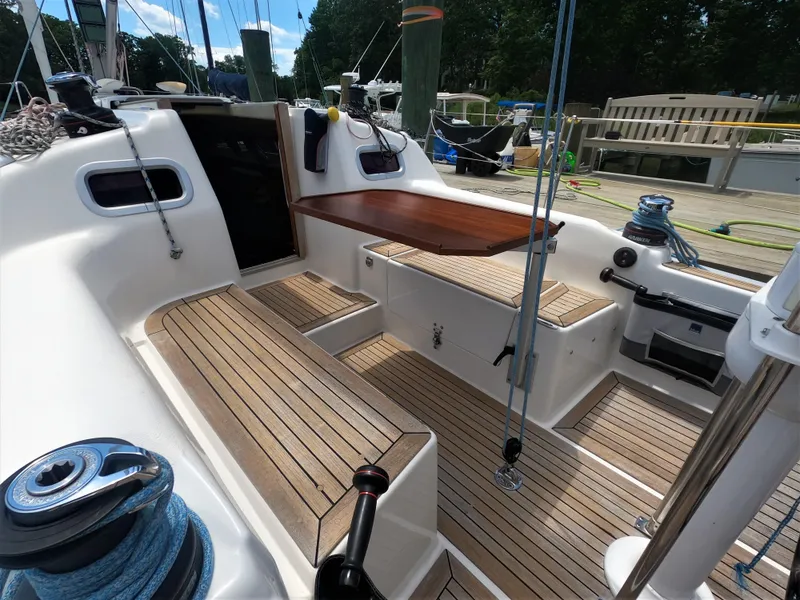 Slide: The Image of Cockpit of a 2010 Finn Flyer 33 R sailboat with teak flooring and seating. - 22