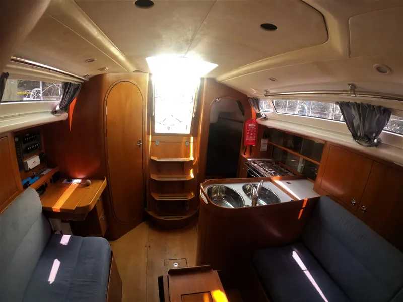 Slide: The Image of Interior of 2010 Finn Flyer 33 R sailboat with wooden cabinetry and seating. - 23