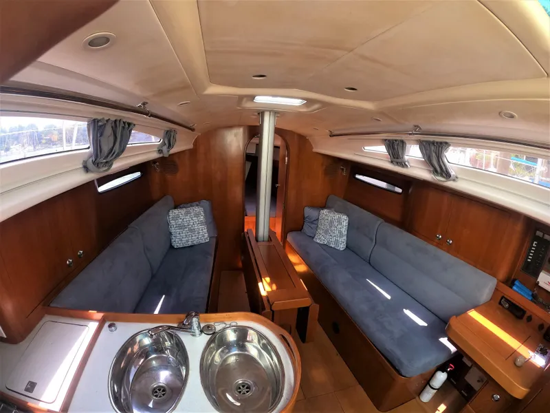 Slide: The Image of Interior of 2010 Finn Flyer 33 R sailboat with cozy seating and kitchen area. - 24