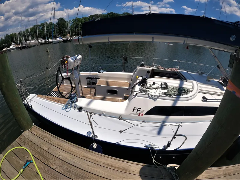 Slide: The Image of 2010 Finn Flyer 33 R sailboat docked at a marina on a sunny day. - 3