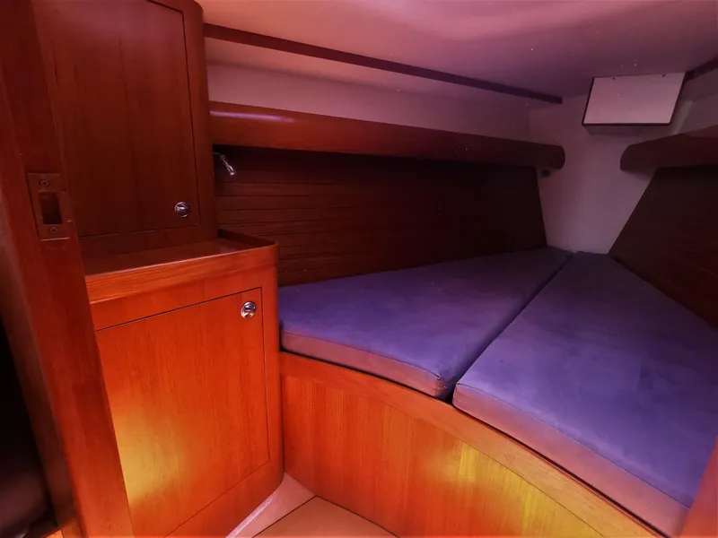 Slide: The Image of Cozy cabin interior of 2010 Finn Flyer 33 R sailboat with wooden finish and cushioned bed. - 31