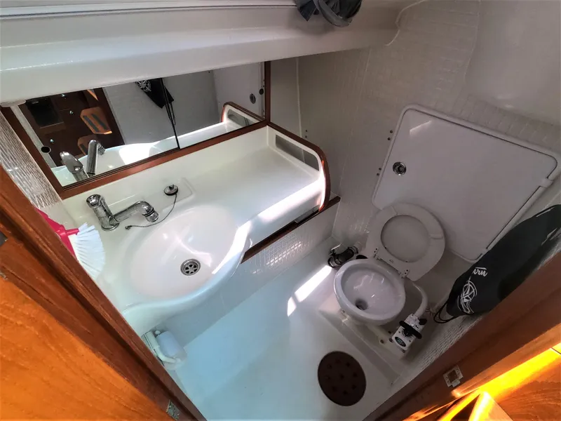 Slide: The Image of Compact bathroom in a 2010 Finn Flyer 33 R sailboat with sink and toilet. - 35