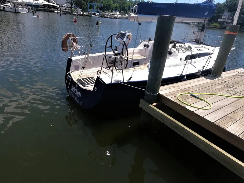 Slide: The Image of 2010 Finn Flyer 33 R sailboat docked at a marina. - 4