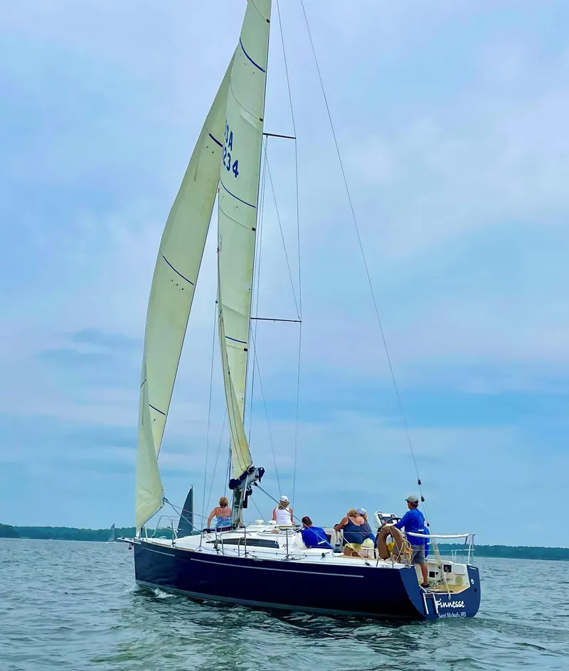 Slide: The Image of 2010 Finn Flyer 33 R sailboat with crew sailing on a calm sea. - 41