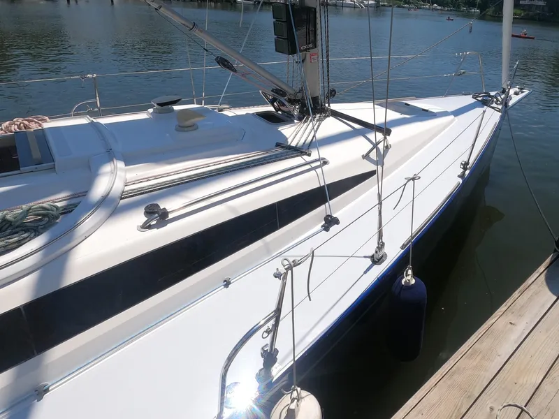 Slide: The Image of 2010 Finn Flyer 33 R sailboat docked on a sunny day. - 5