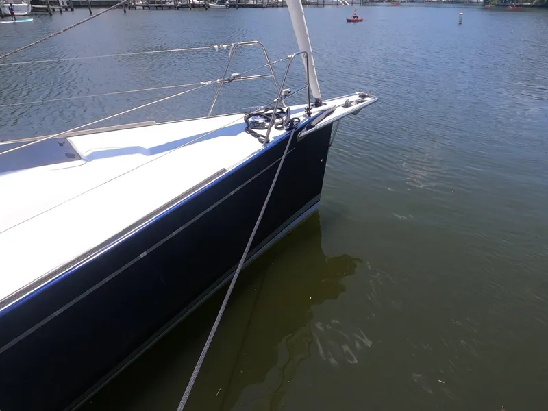 Slide: The Image of 2010 Finn Flyer 33 R sailboat docked in calm waters. - 7