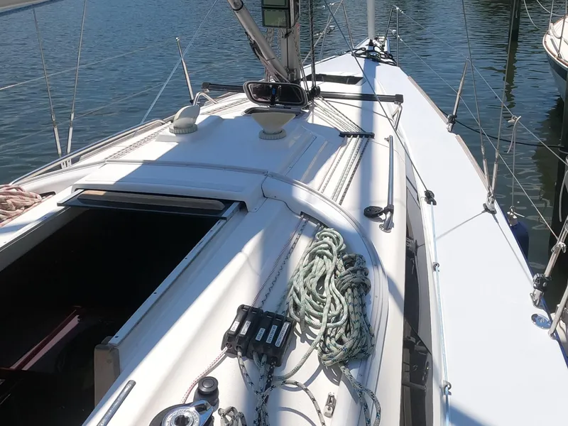 Slide: The Image of 2010 Finn Flyer 33 R sailboat deck with rigging and open hatch. - 9