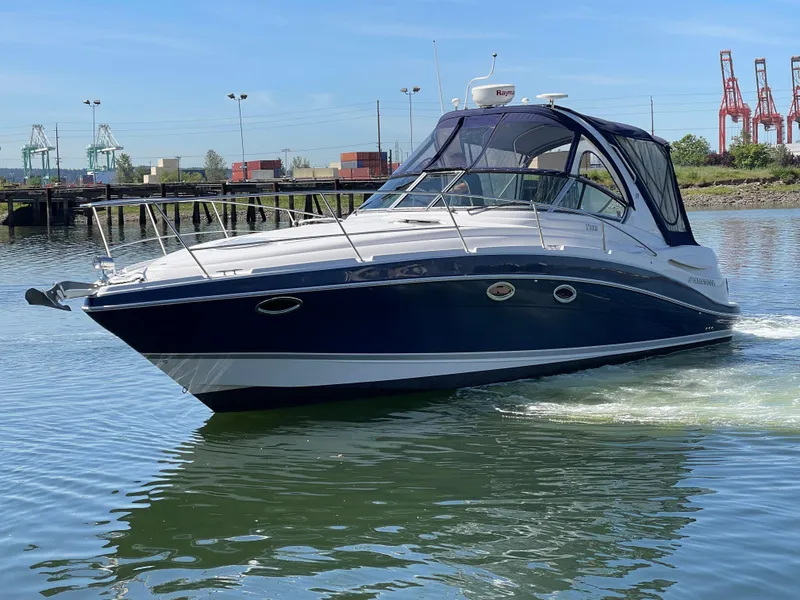 Slide: The Image of 2008 Four Winns V338 boat cruising in a harbor. - 2