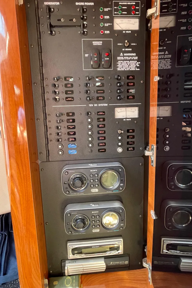 Slide: The Image of 2008 Four Winns V338 control panel with switches and gauges. - 30