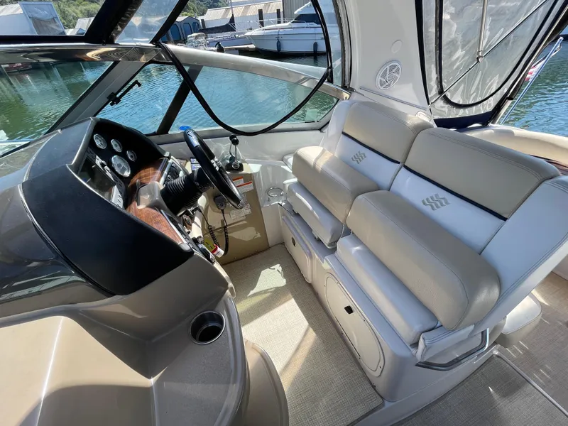 Slide: The Image of 2008 Four Winns V338 boat interior with helm and seating area. - 32