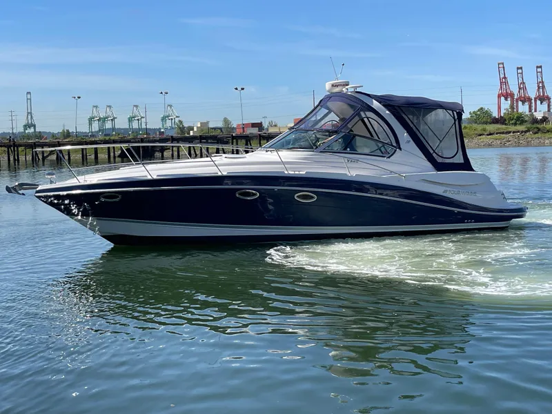 Slide: The Image of 2008 Four Winns V338 boat cruising on a calm waterway. - 37