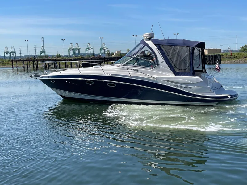 Slide: The Image of 2008 Four Winns V338 boat cruising on calm water. - 38