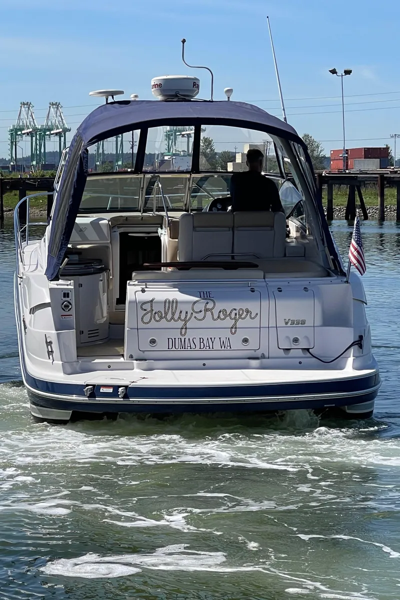 Slide: The Image of 2008 Four Winns V338 boat named Jolly Roger cruising in a harbor. - 39