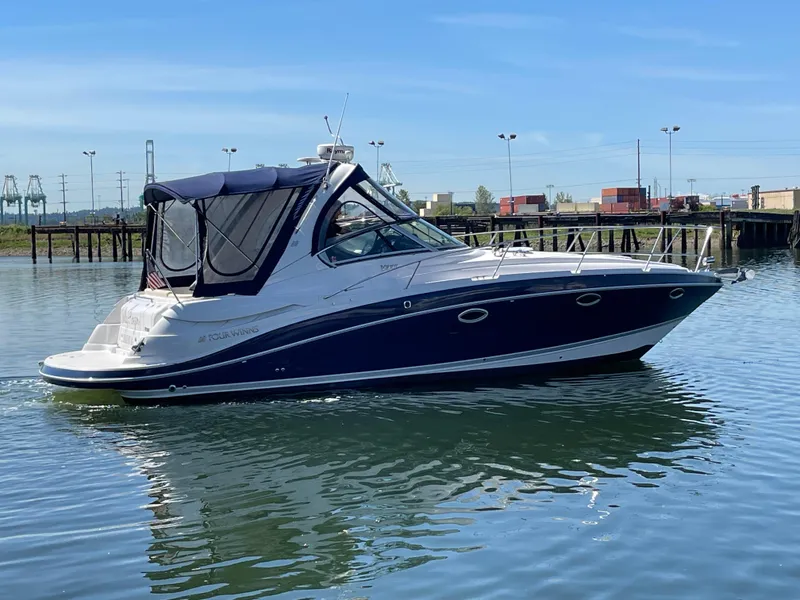 Slide: The Image of 2008 Four Winns V338 boat on calm water with marina background. - 40