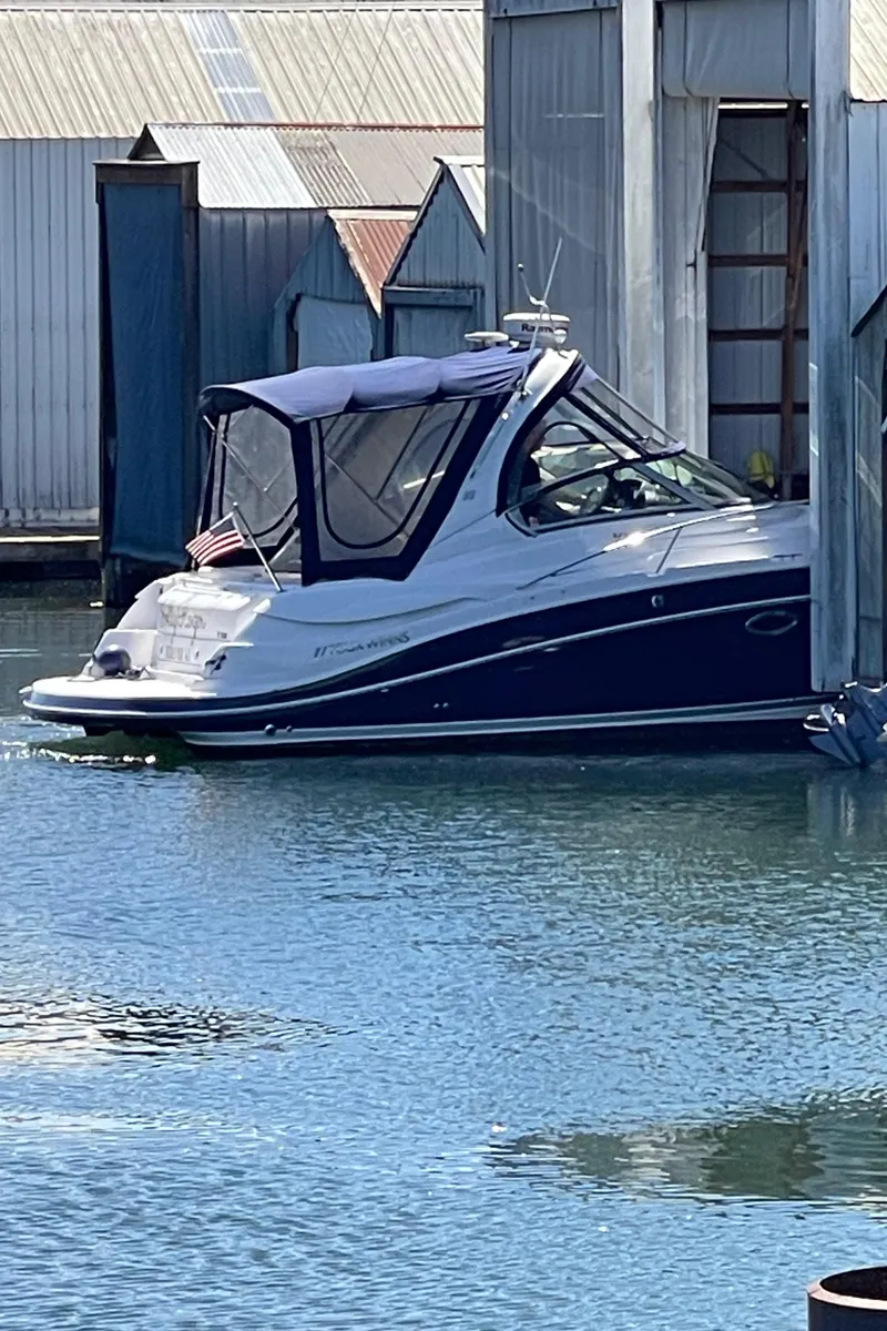 Slide: The Image of 2008 Four Winns V338 boat docked in a marina. - 49