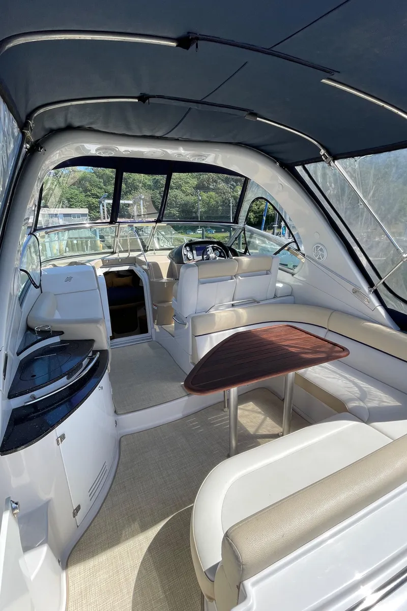 Slide: The Image of 2008 Four Winns V338 yacht interior with seating and helm station. - 6