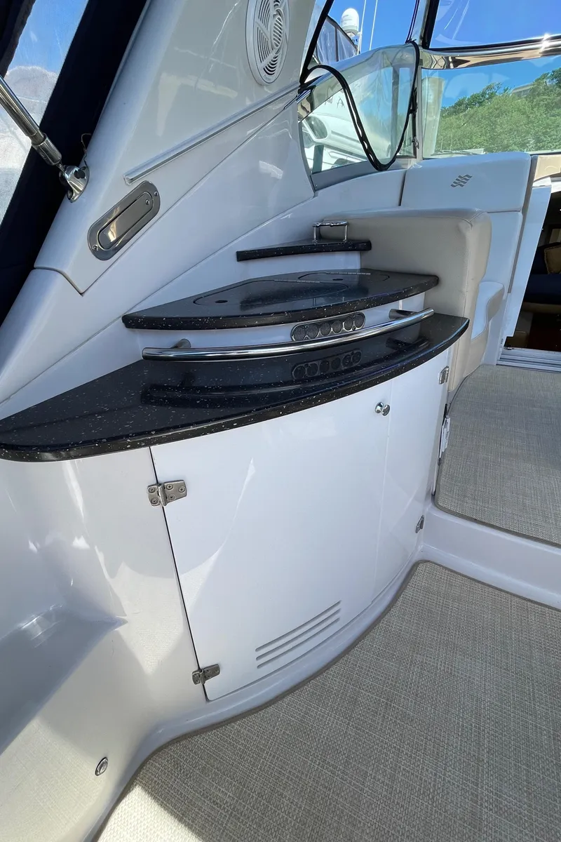 Slide: The Image of 2008 Four Winns V338 boat interior with sleek cabinetry and modern design. - 9