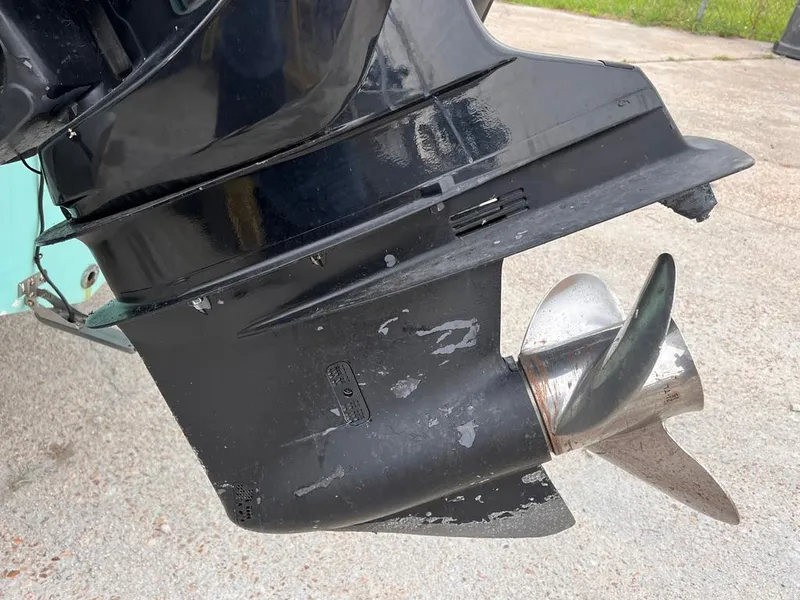 Slide: The Image of Close-up of a 1978 Excalibur 32 boat propeller and lower unit. - 11