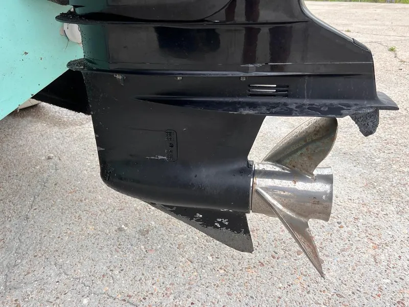 Slide: The Image of Close-up of a 1978 Excalibur 32 boat propeller and lower unit. - 12