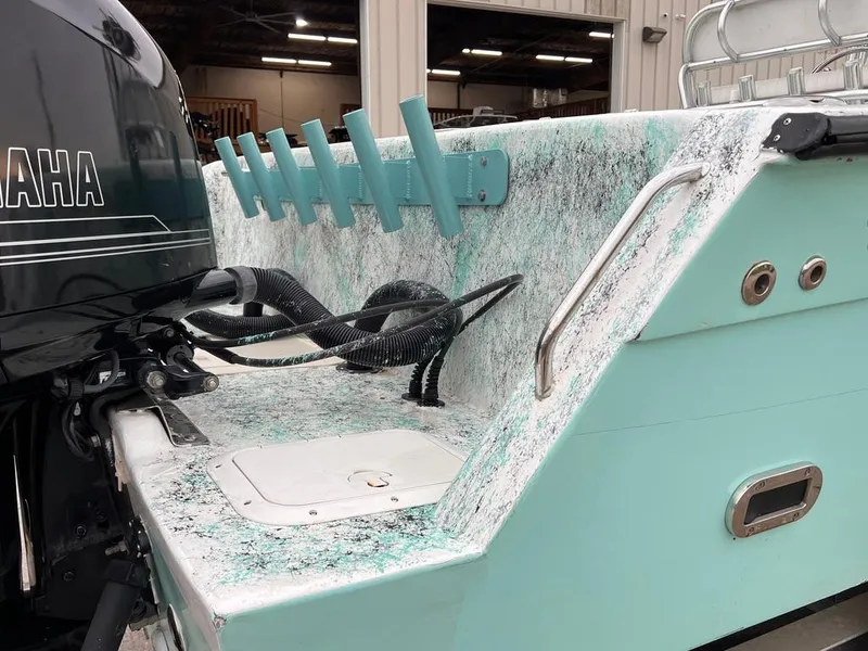 Slide: The Image of 1978 Excalibur 32 boat with Yamaha outboard motor and fishing rod holders. - 13