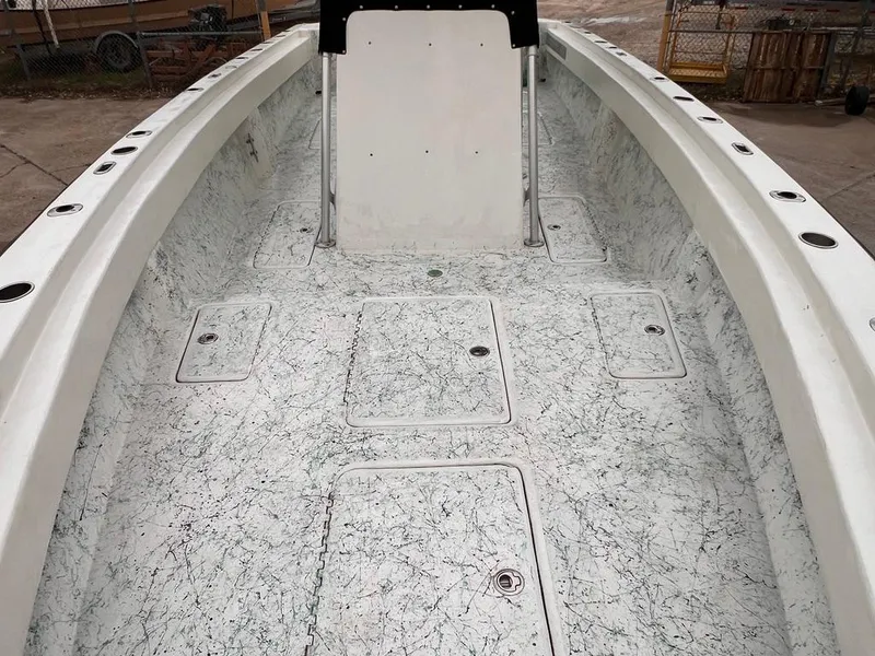 Slide: The Image of 1978 Excalibur 32 boat interior with white and black speckled flooring. - 15