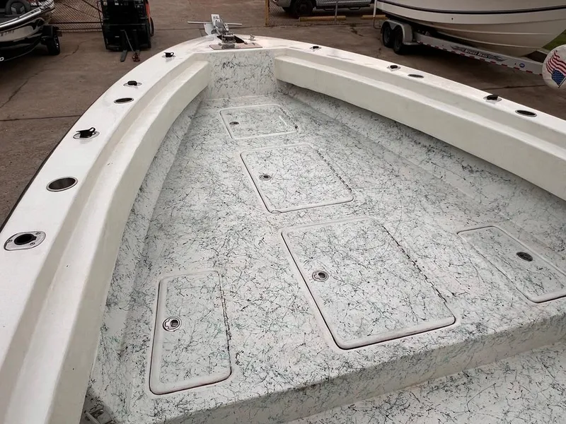 Slide: The Image of 1978 Excalibur 32 boat interior with storage compartments and rod holders. - 16