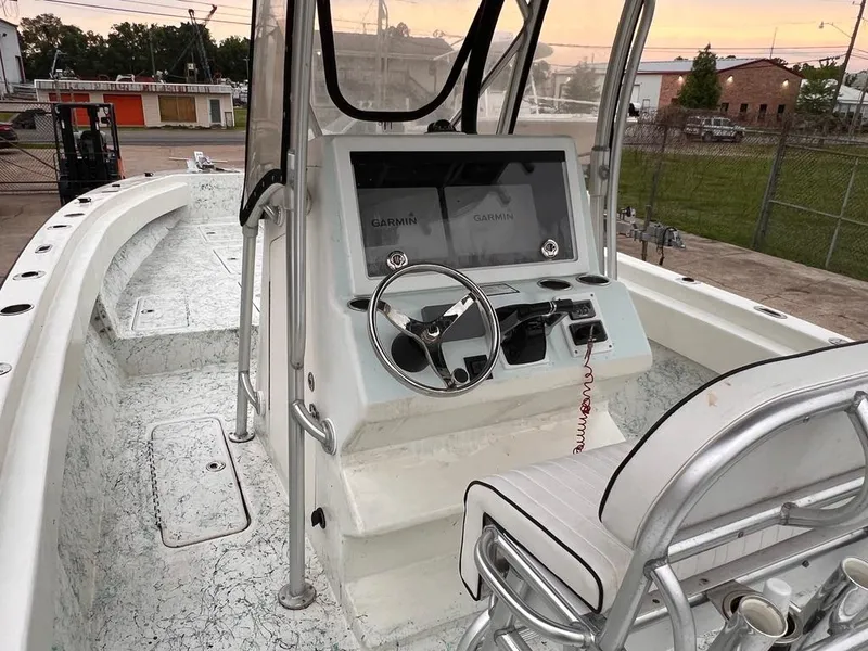 Slide: The Image of 1978 Excalibur 32 boat cockpit with steering wheel and navigation screens. - 20