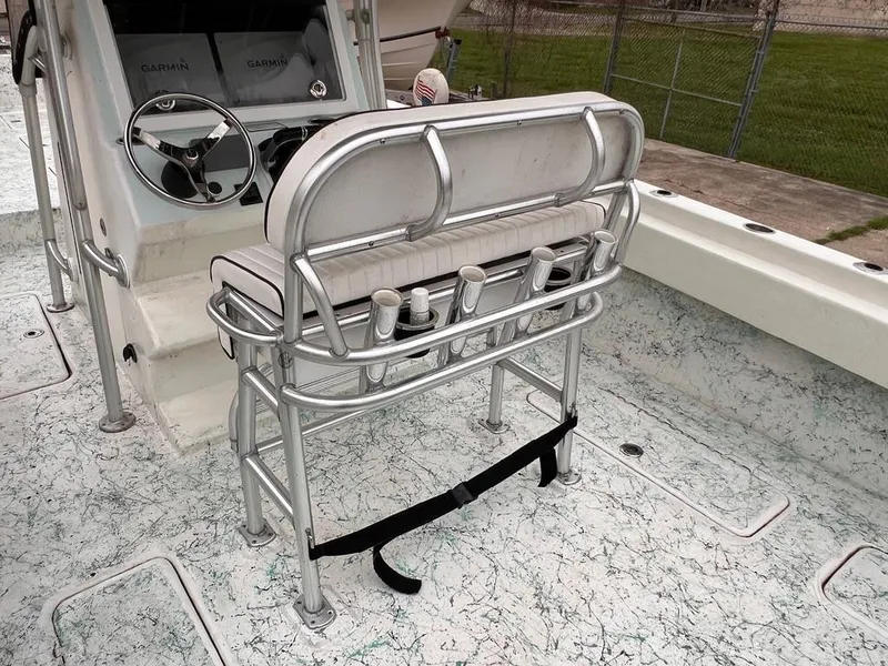 Slide: The Image of 1978 Excalibur 32 boat interior with steering console and seating. - 21