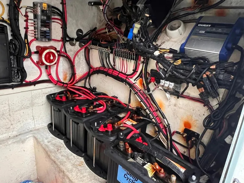 Slide: The Image of 1978 Excalibur 32 boat electrical system with batteries and wiring. - 25