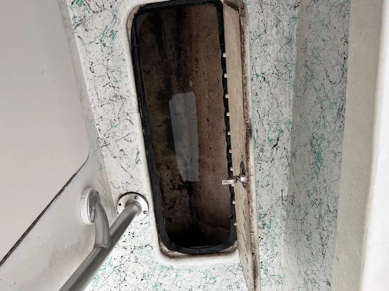 Slide: The Image of Open hatch on a 1978 Excalibur 32 boat with a weathered interior. - 29