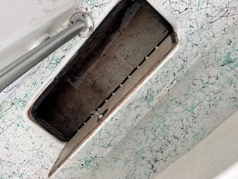 Slide: The Image of 1978 Excalibur 32 boat storage compartment with open hatch. - 30