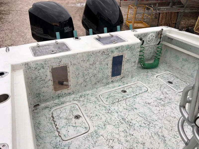 Slide: The Image of 1978 Excalibur 32 boat deck with twin Yamaha 250 engines. - 31