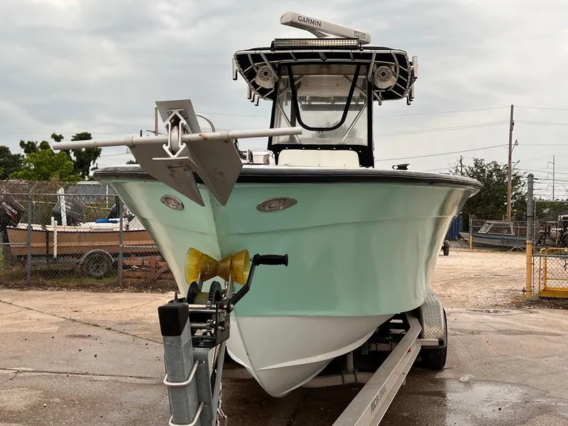 Slide: The Image of 1978 Excalibur 32 boat on trailer, front view. - 9