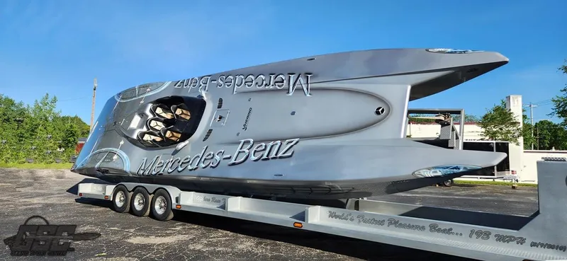 The Image of 2007 MTI 44 AMG TRIBUTE powerboat on a trailer, featuring Mercedes-Benz branding. - 1