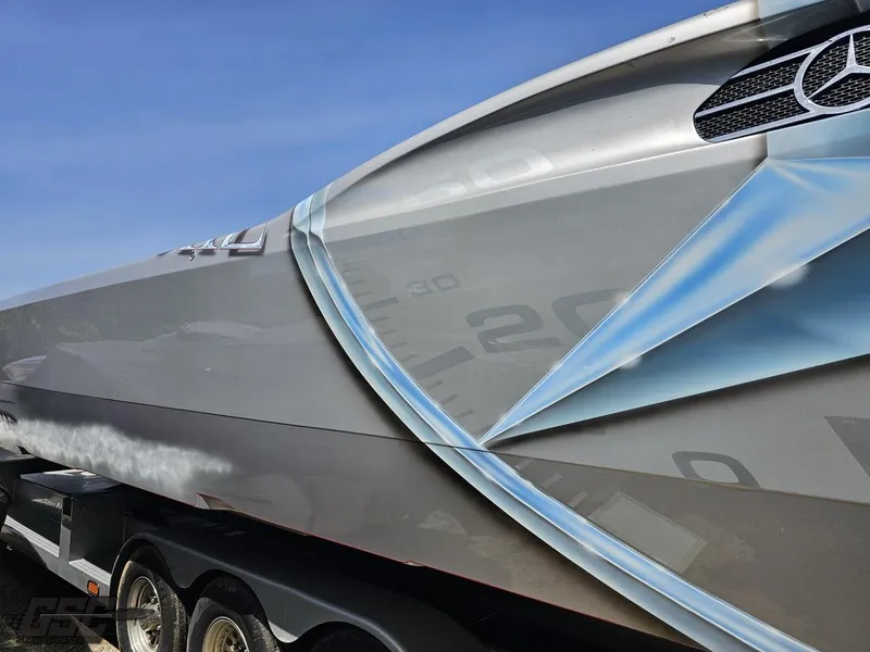 Slide: The Image of 2007 MTI 44 AMG TRIBUTE boat with sleek design on trailer. - 14