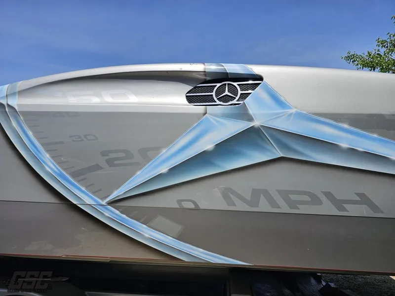 Slide: The Image of Close-up of 2007 MTI 44 AMG TRIBUTE boat with Mercedes-Benz logo and speedometer graphic. - 15