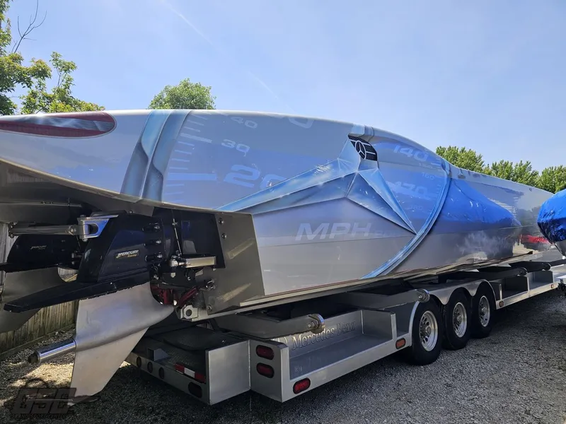 Slide: The Image of 2007 MTI 44 AMG TRIBUTE speedboat on a trailer, rear view. - 16