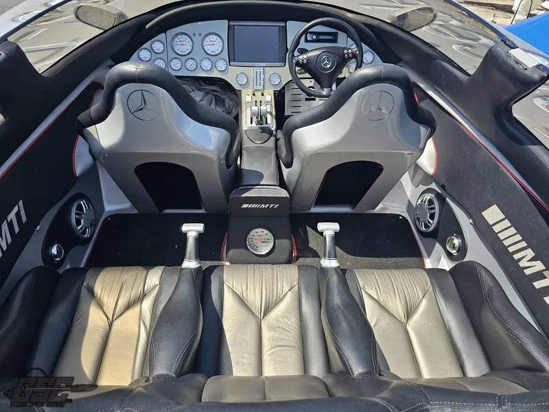 Slide: The Image of Interior of a 2007 MTI 44 AMG TRIBUTE speedboat with leather seats and advanced dashboard. - 30