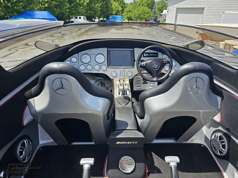 Slide: The Image of 2007 MTI 44 AMG TRIBUTE boat cockpit with Mercedes-Benz branded seats and dashboard. - 31