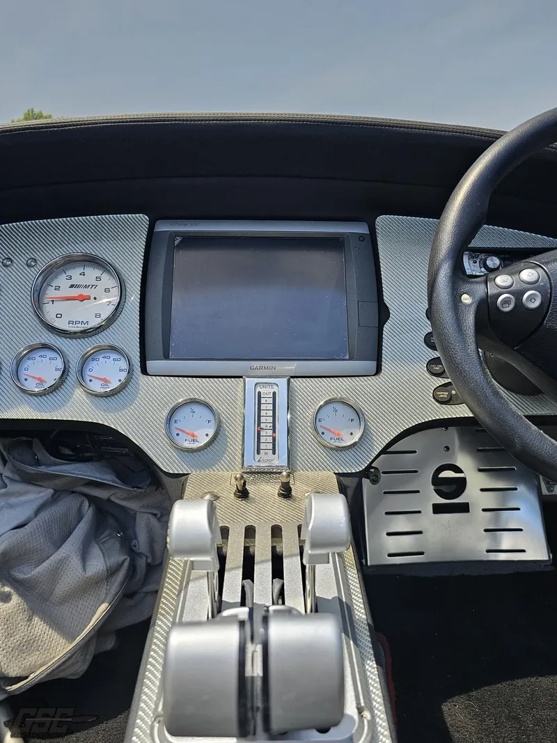 Slide: The Image of Dashboard of a 2007 MTI 44 AMG TRIBUTE boat with gauges and controls. - 35