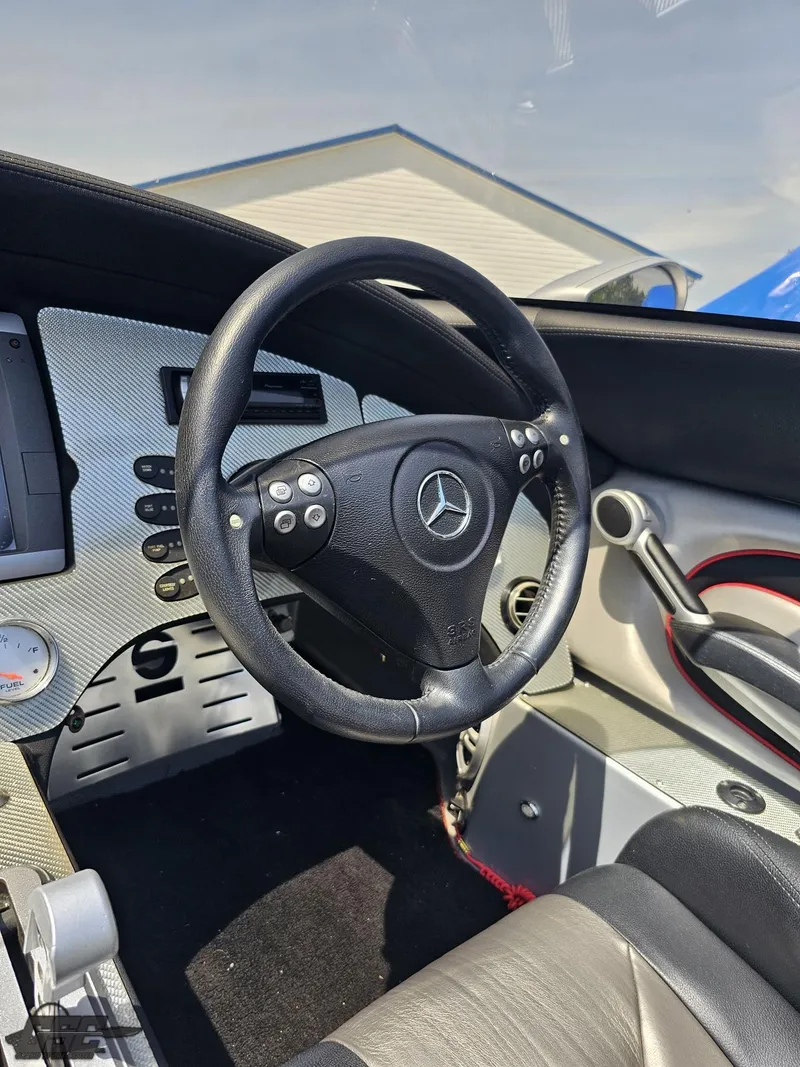 Slide: The Image of Steering wheel and dashboard of a 2007 MTI 44 AMG TRIBUTE boat. - 37