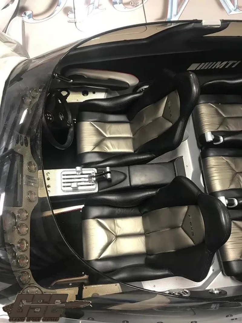 Slide: The Image of 2007 MTI 44 AMG TRIBUTE boat interior with black and silver seats. - 43